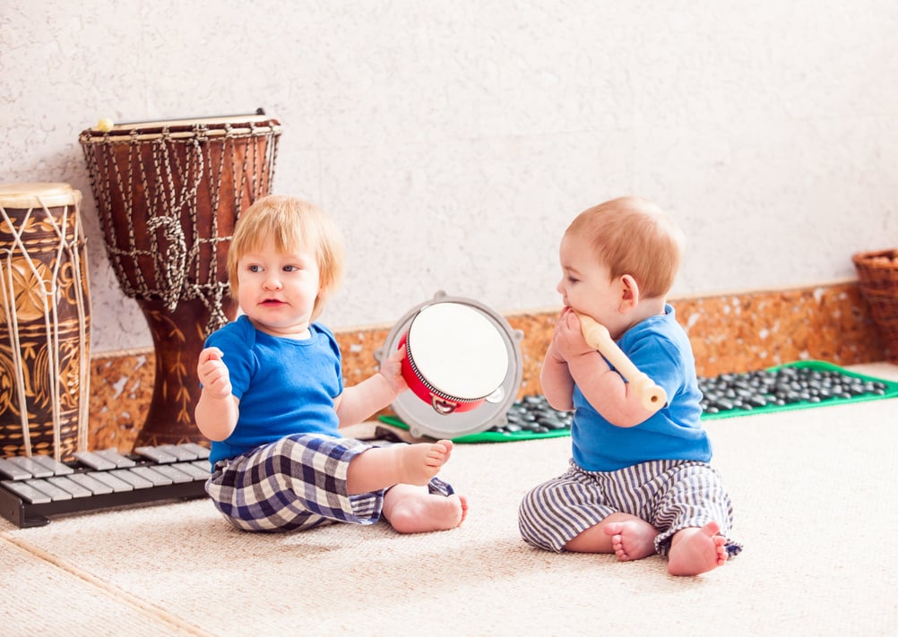 Baby Boys Playing with Musical Instruments at Daycare